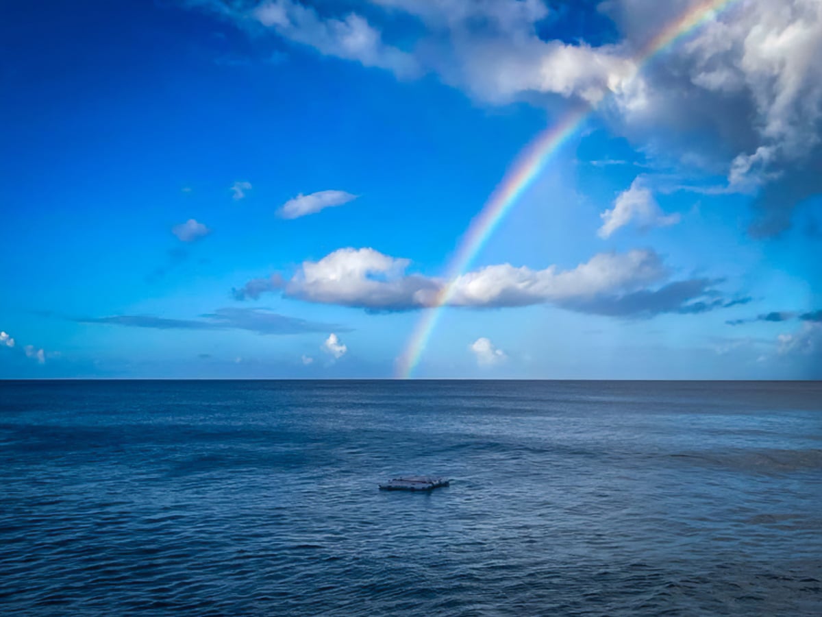 Dawn rainbow over the Caribbean Sea.